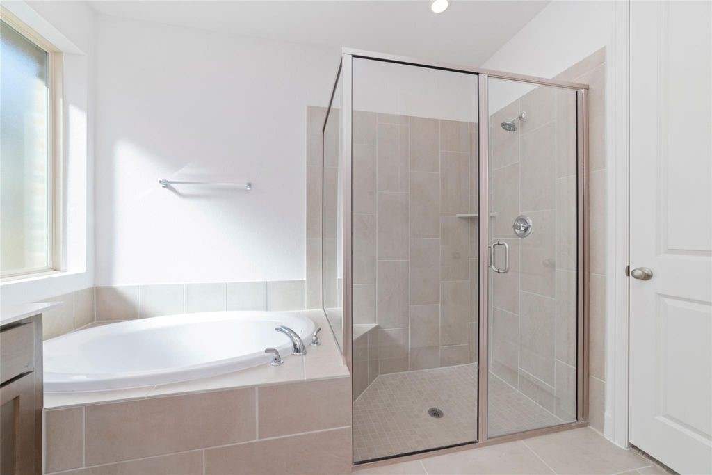 1434 Girasol Street Magnolia, TX 77354 - Photo 22 of 22 a bathroom with a bathtub shower and toilet