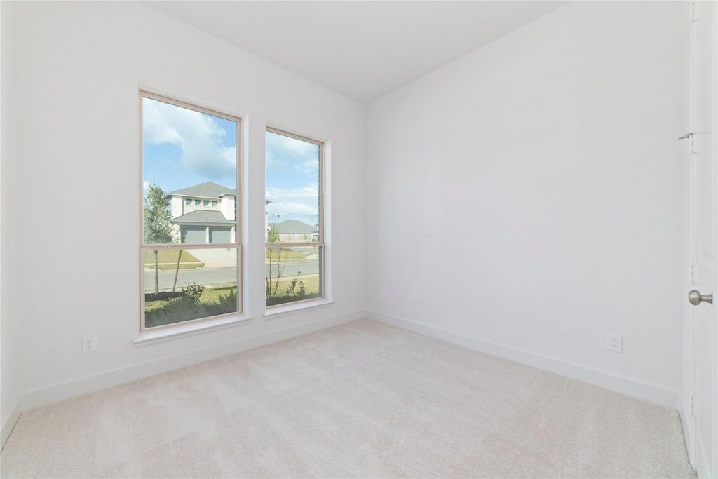 1434 Girasol Street Magnolia, TX 77354 - Photo 6 of 22 an empty room with windows