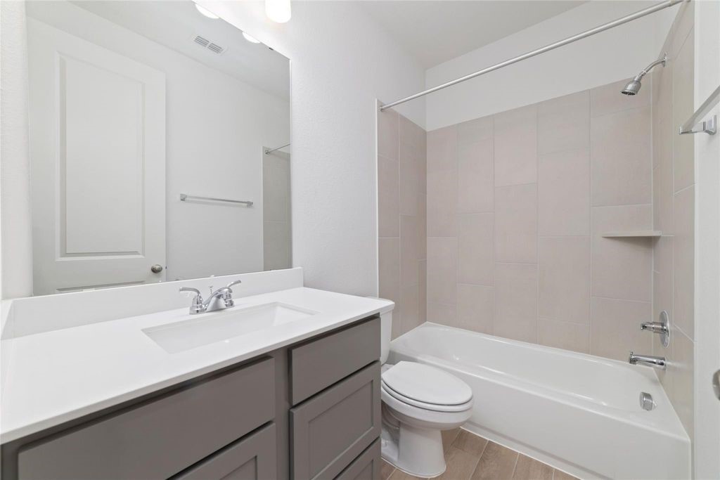 1434 Girasol Street Magnolia, TX 77354 - Photo 9 of 22 a bathroom with a sink a toilet and shower