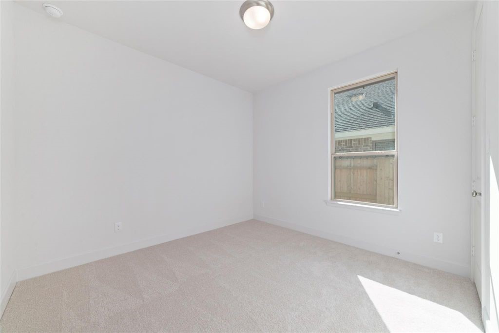 1434 Girasol Street Magnolia, TX 77354 - Photo 10 of 22 an empty room with a window