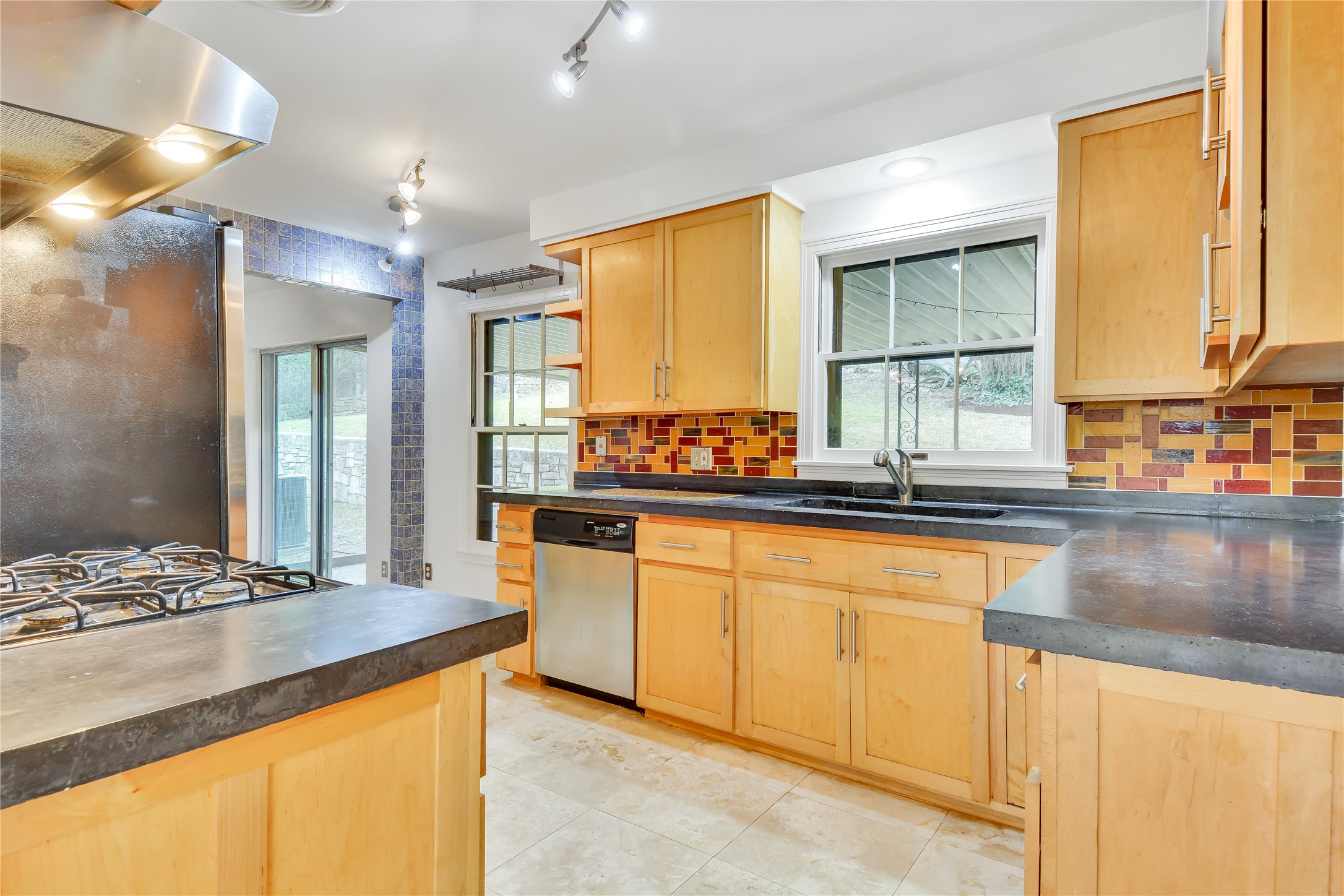 2300 Rebel Road Austin, TX 78704 - Photo 10 of 26 A well-equipped kitchen features a gas range, dishwasher, and ample cabinetry for culinary pursuits.