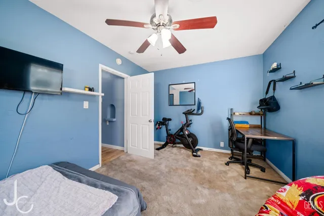 a bedroom with furniture and a window