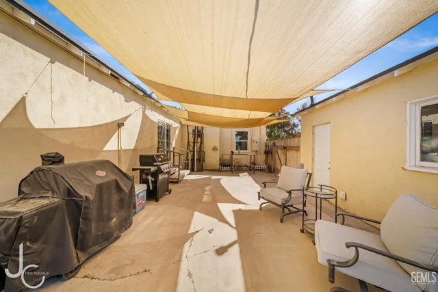 a bed room with a bed and chair