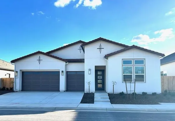 a front view of a house with a garage
