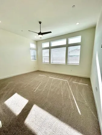a spacious bathroom with a double vanity sink and a large mirror