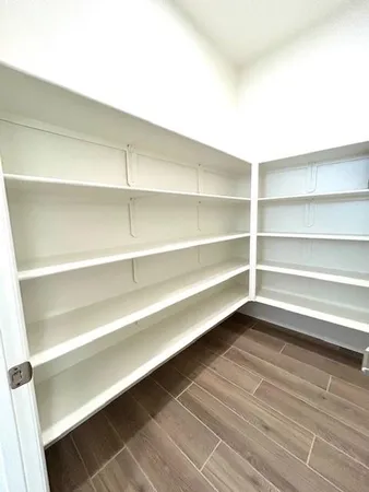 a view of a room with shelf on the wall