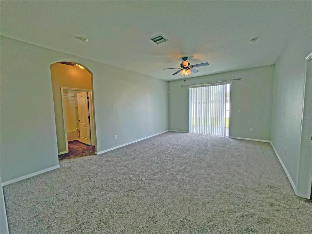 24925 Vintage Court Lutz, FL 33559 - Photo 13 of 38 an empty room with windows and cabinet