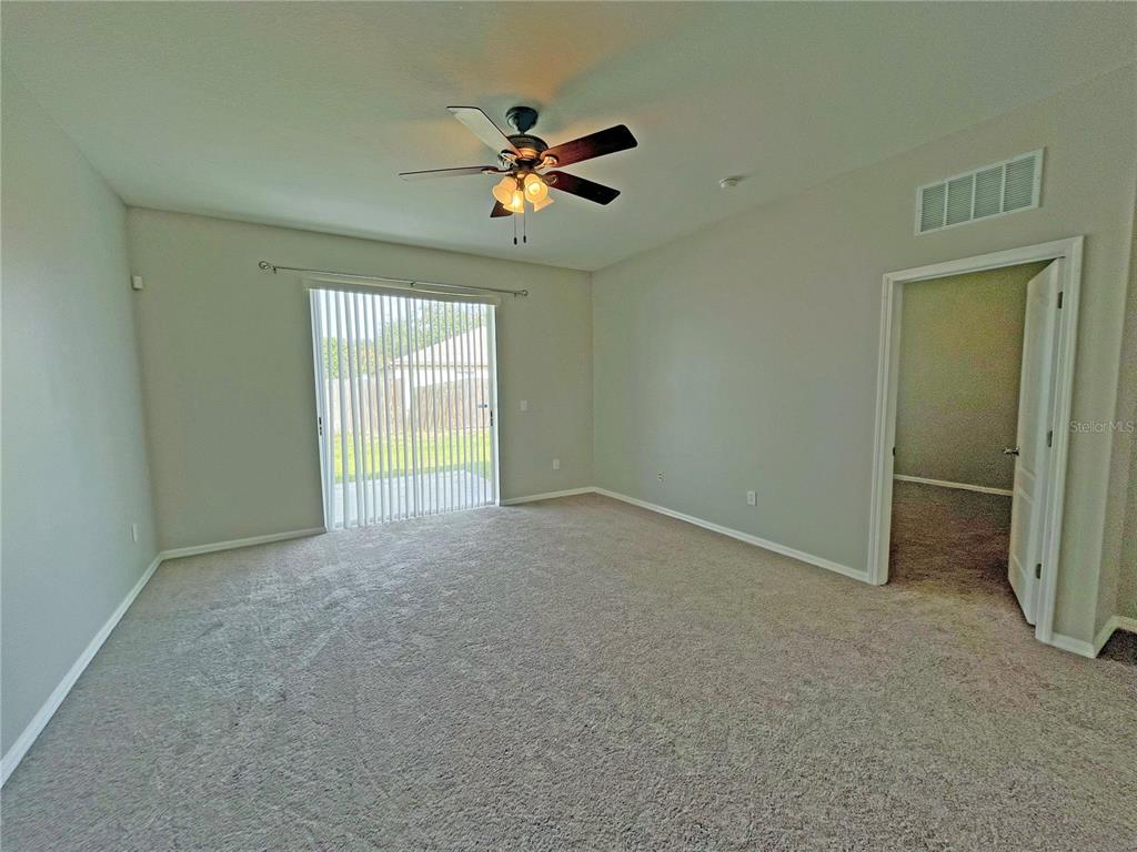 24925 Vintage Court Lutz, FL 33559 - Photo 14 of 38 a view of an empty room with a window