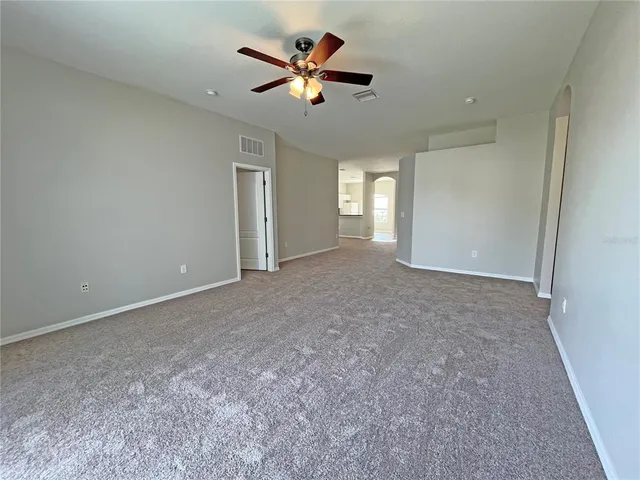 a view of a big room with carpet