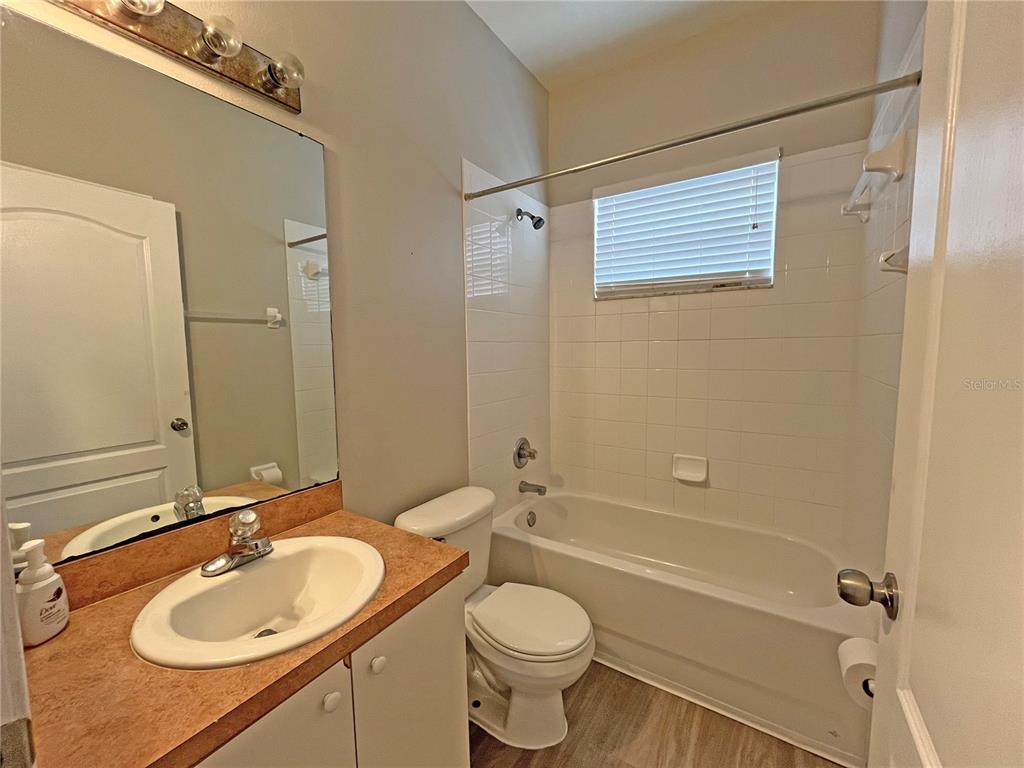 24925 Vintage Court Lutz, FL 33559 - Photo 21 of 38 a bathroom with a sink a toilet and shower