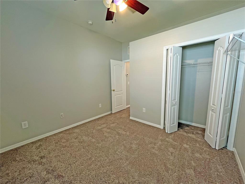 24925 Vintage Court Lutz, FL 33559 - Photo 26 of 38 an empty room with closet area