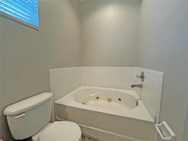 a white bath tub sitting in a bathroom