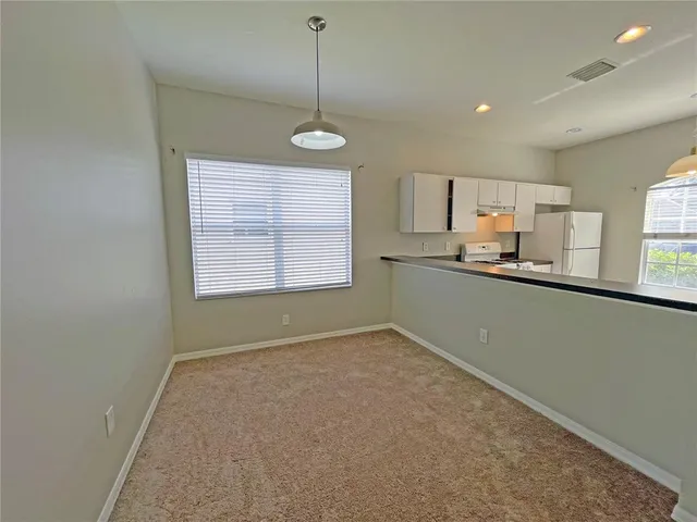 a view of kitchen and windows