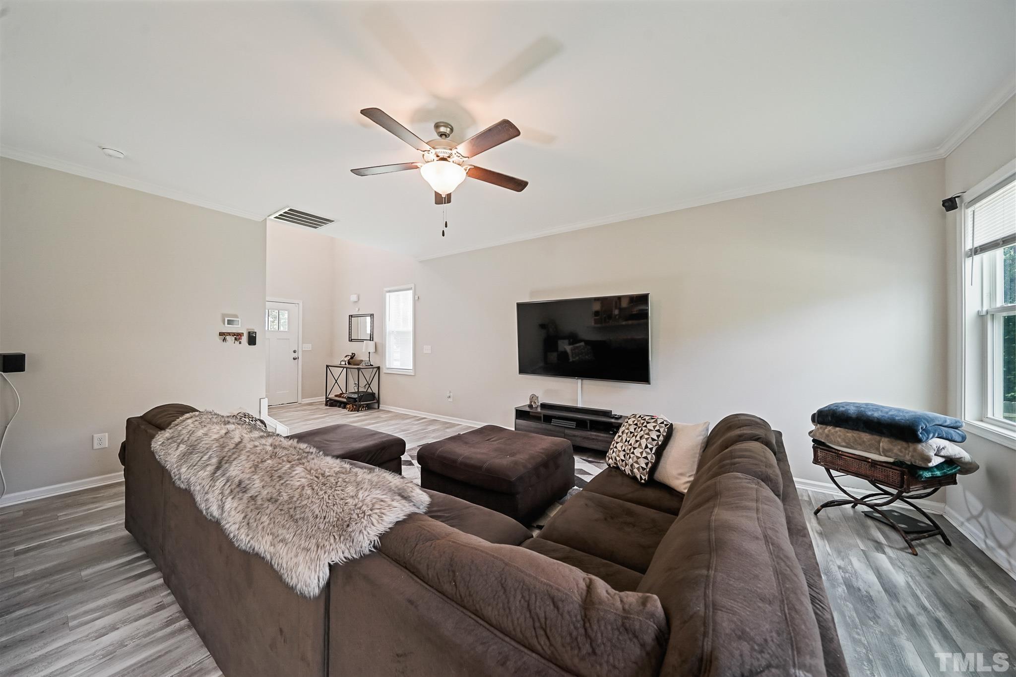 856 Juno Drive Broadway, NC 27505 - Photo 18 of 46 a living room with furniture and a flat screen tv