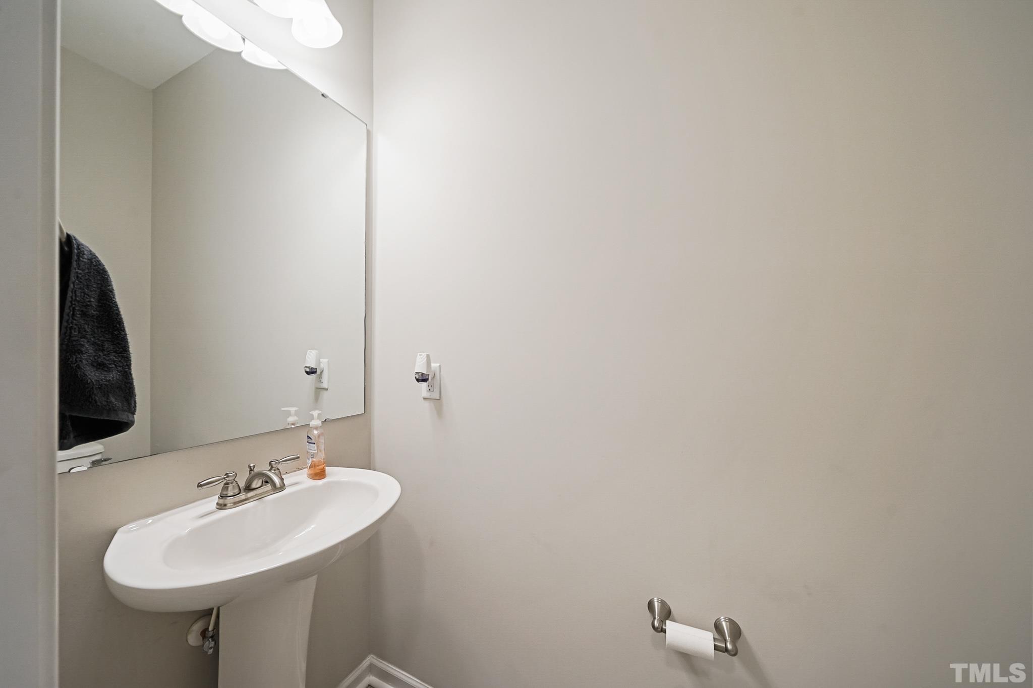 856 Juno Drive Broadway, NC 27505 - Photo 24 of 46 a bathroom with a sink and a mirror