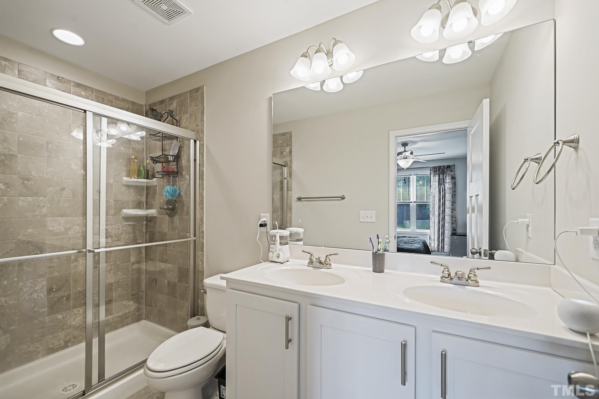 856 Juno Drive Broadway, NC 27505 - Photo 28 of 46 a bathroom with a sink a toilet and shower