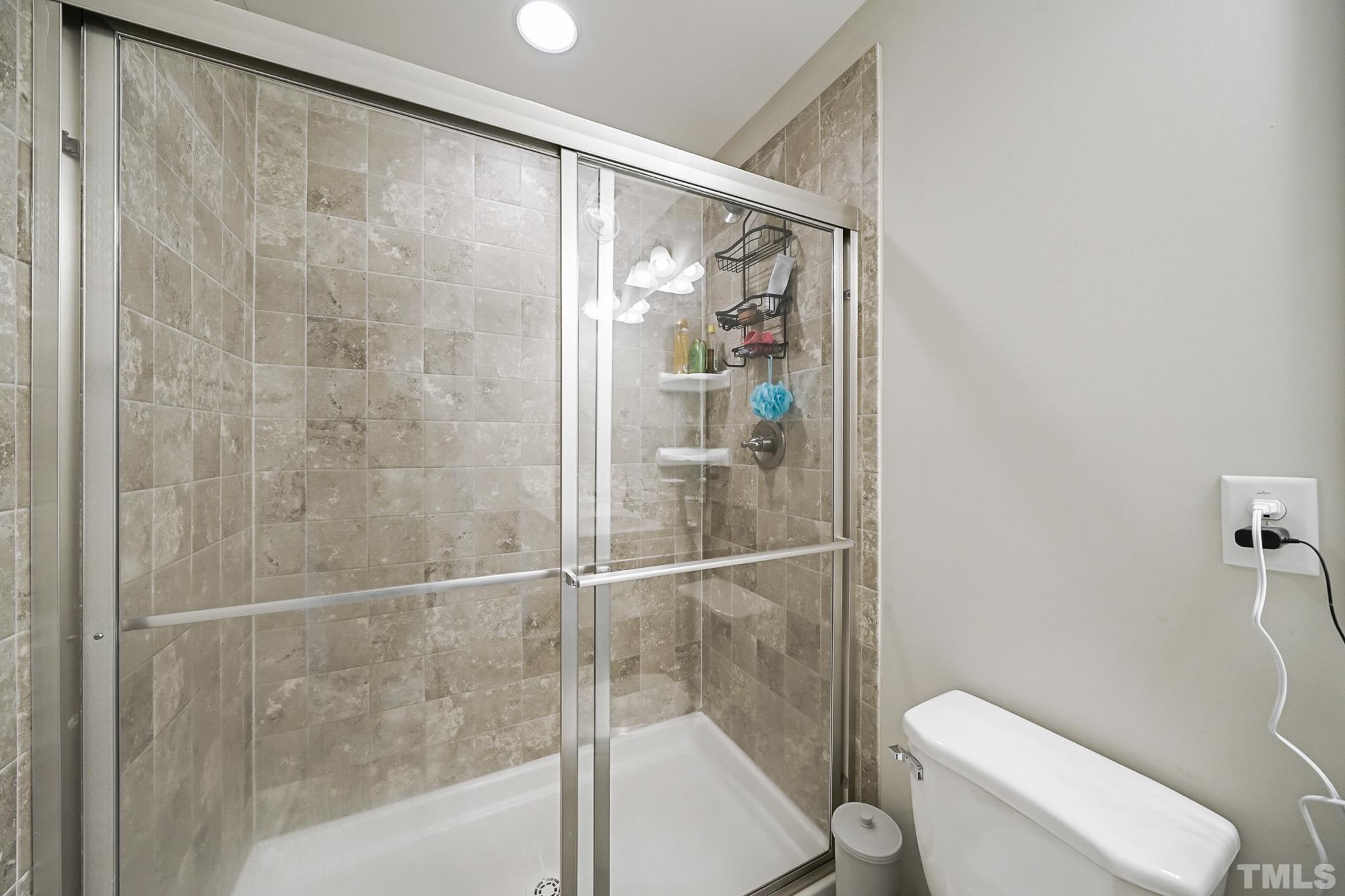 856 Juno Drive Broadway, NC 27505 - Photo 29 of 46 a bathroom with a shower and a toilet
