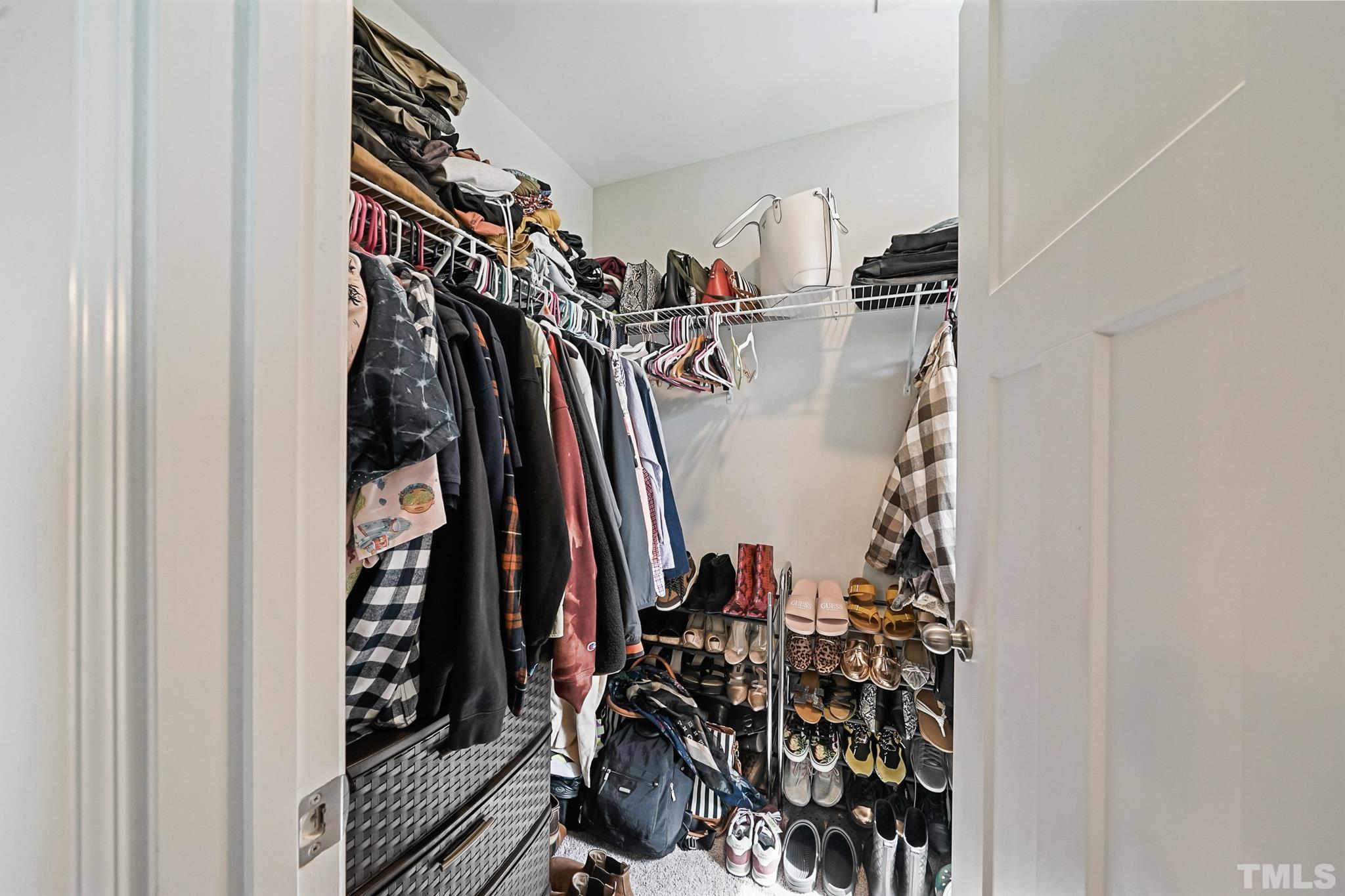 856 Juno Drive Broadway, NC 27505 - Photo 30 of 46 a view of walk in closet with clothes