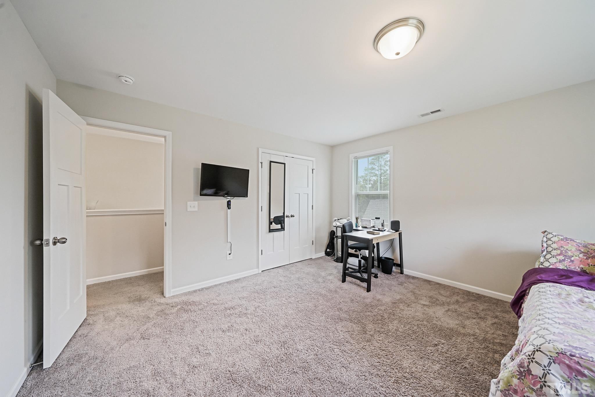 856 Juno Drive Broadway, NC 27505 - Photo 38 of 46 a living room with furniture and a flat screen tv