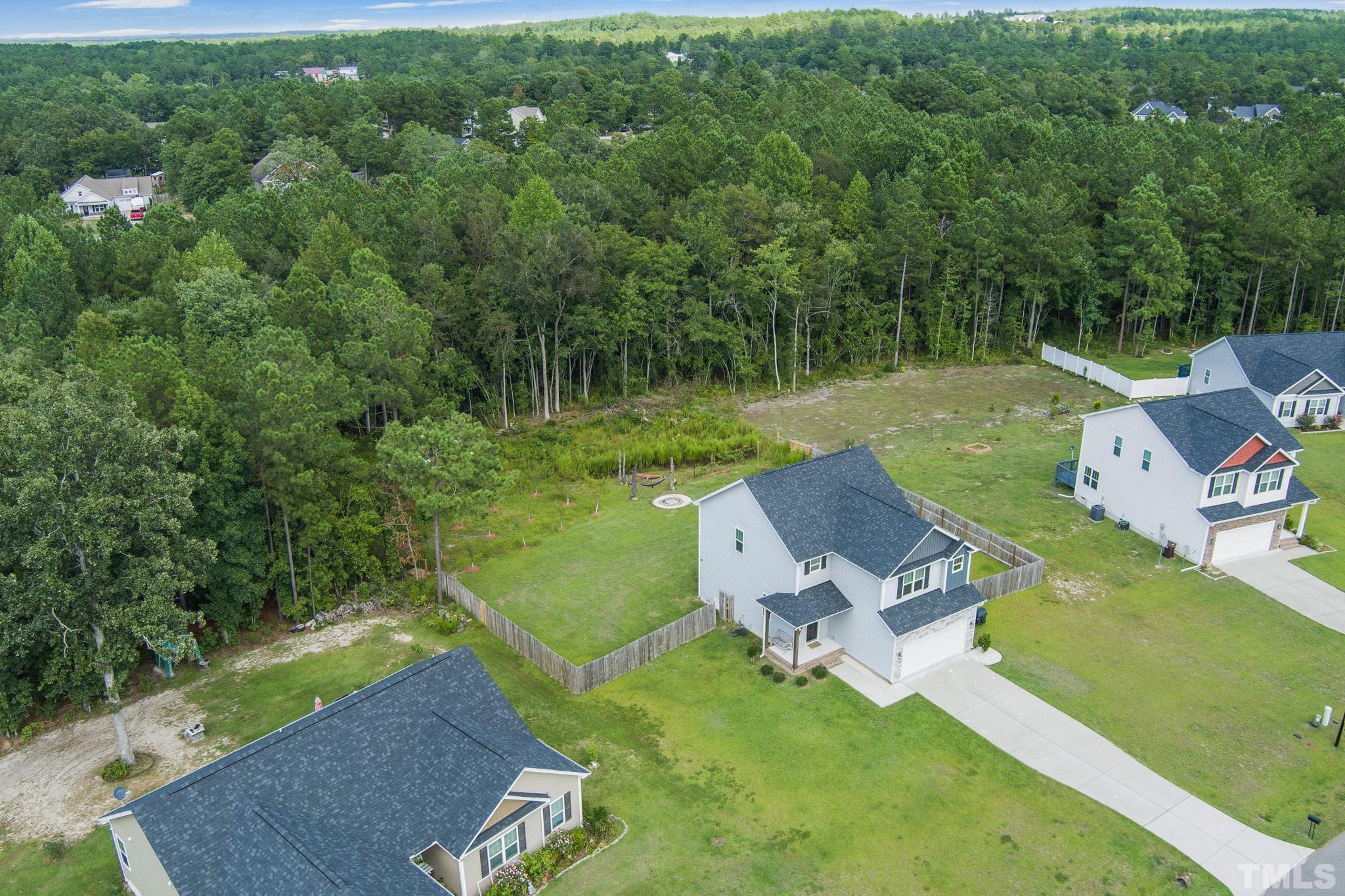 856 Juno Drive Broadway, NC 27505 - Photo 41 of 46 an aerial view of a house with swimming pool and a yard