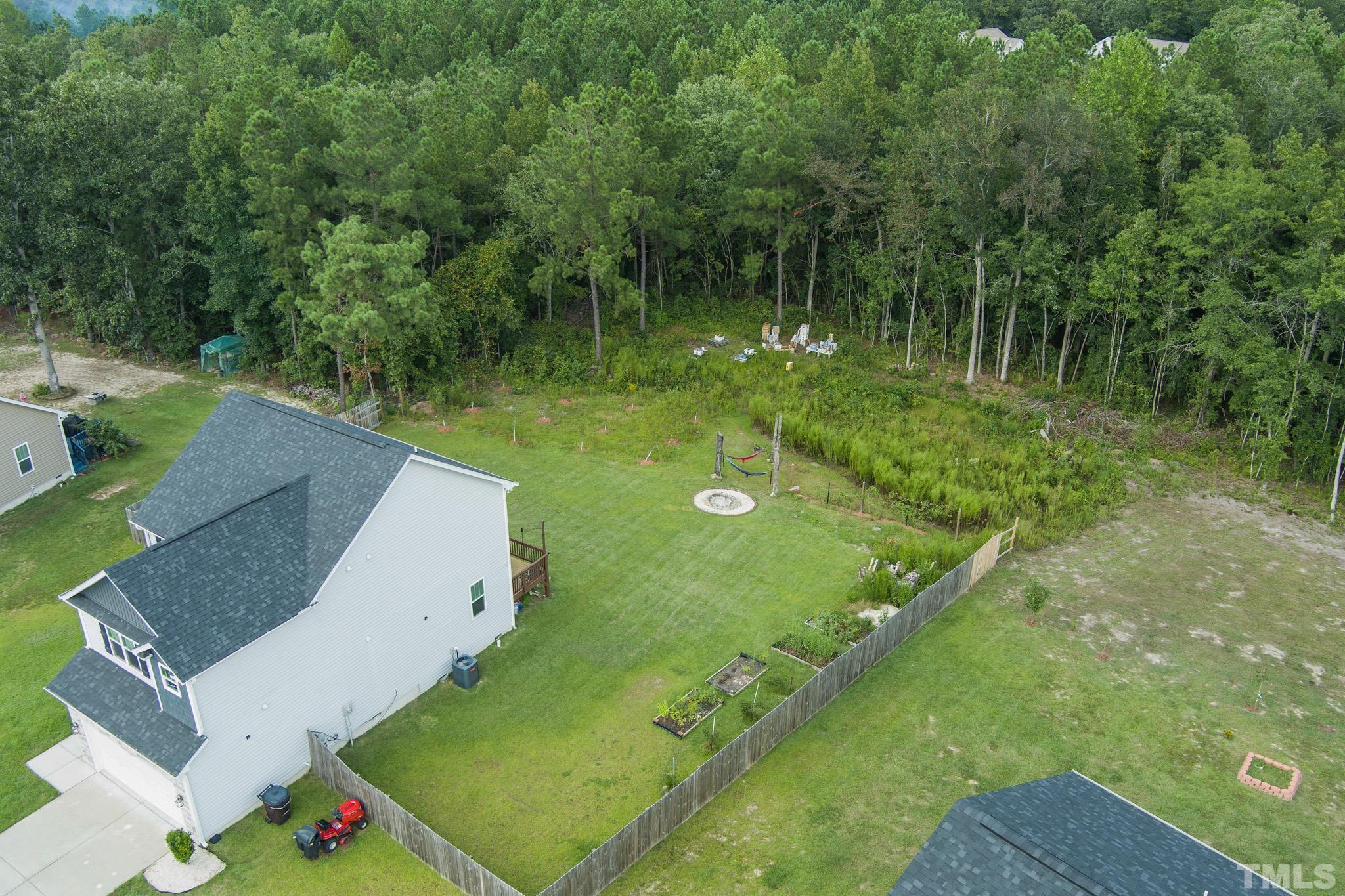 856 Juno Drive Broadway, NC 27505 - Photo 43 of 46 a view of a lake with a yard