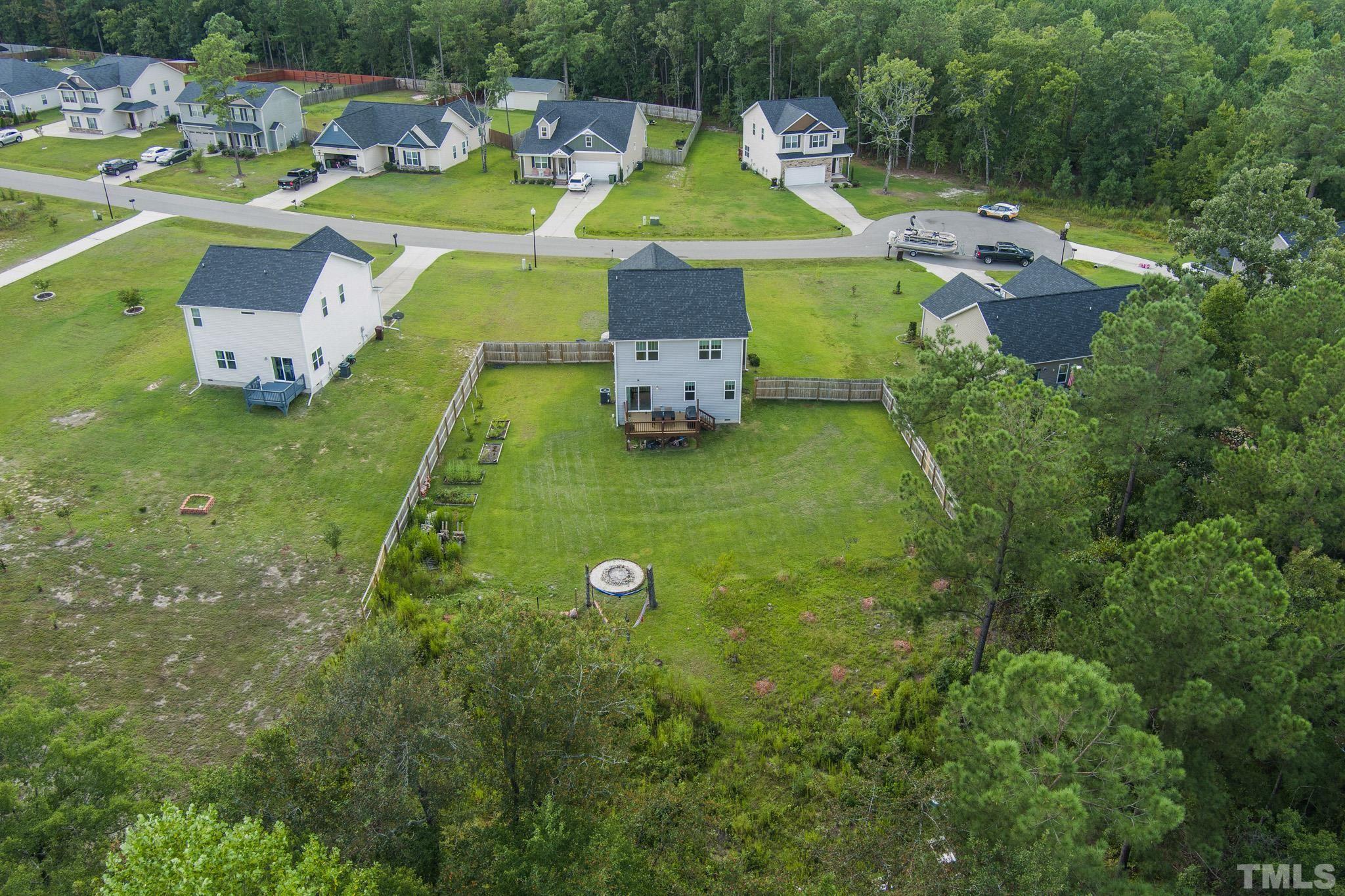 856 Juno Drive Broadway, NC 27505 - Photo 45 of 46 an aerial view of a house with a swimming pool outdoor seating and yard