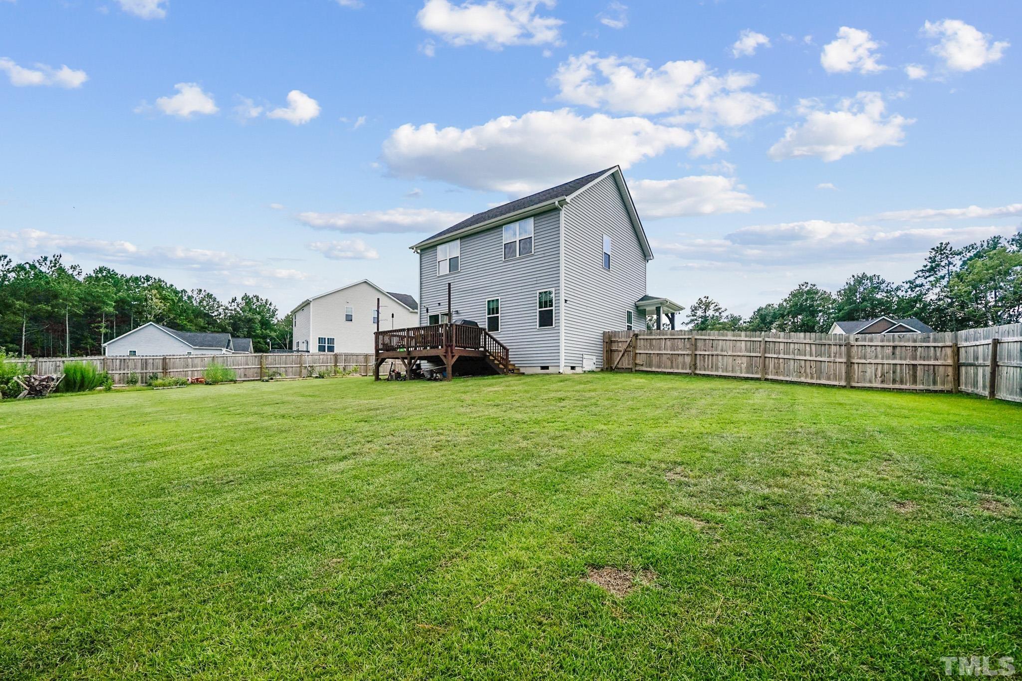 856 Juno Drive Broadway, NC 27505 - Photo 5 of 46 a view of yard with swimming pool and green space