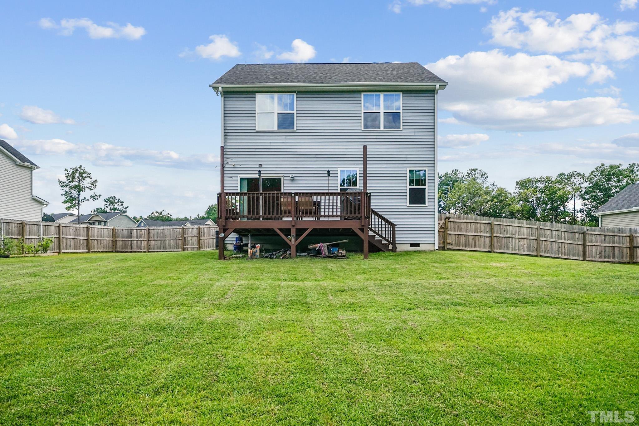 856 Juno Drive Broadway, NC 27505 - Photo 7 of 46 a view of a house with backyard and a garden