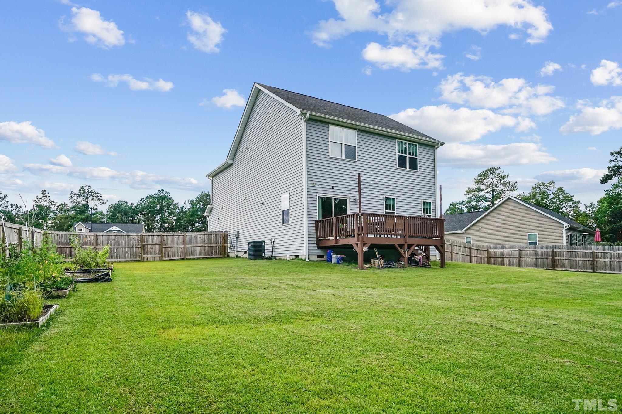 856 Juno Drive Broadway, NC 27505 - Photo 8 of 46 a view of a house with a big yard
