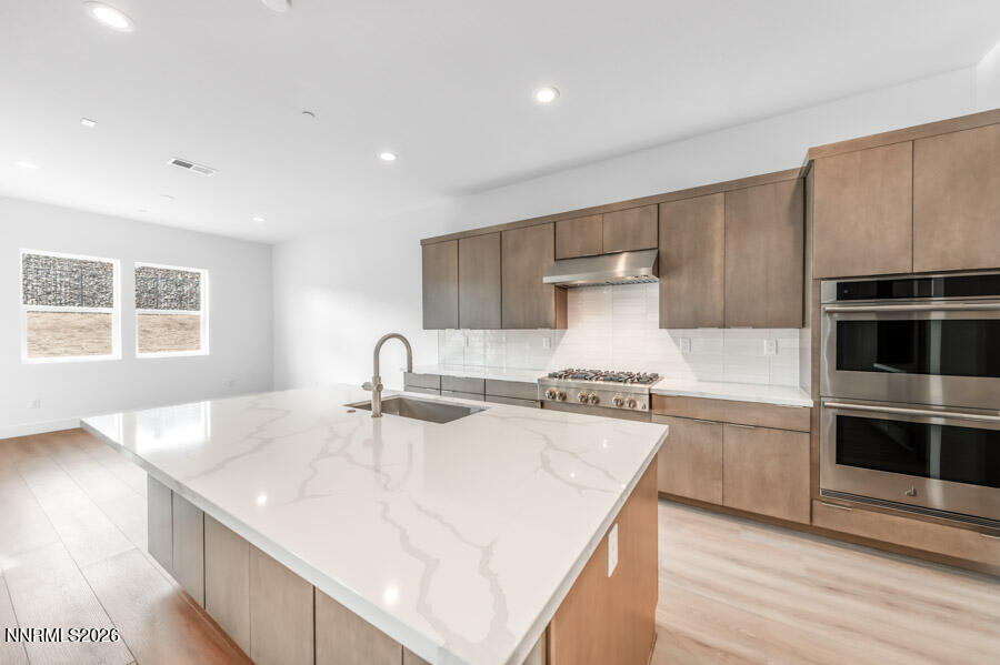 2400 Arrowroot Way, Unit CINNAMON 84 Sparks, NV 89441 - Photo 11 of 27 a kitchen with stainless steel appliances granite countertop a sink and a stove