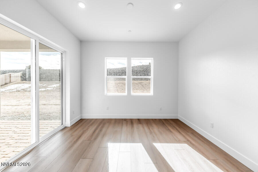 2400 Arrowroot Way, Unit CINNAMON 84 Sparks, NV 89441 - Photo 17 of 27 an empty room with wooden floor and windows