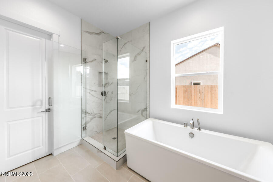2400 Arrowroot Way, Unit CINNAMON 84 Sparks, NV 89441 - Photo 20 of 27 a spacious bathroom with a bathtub shower and sink