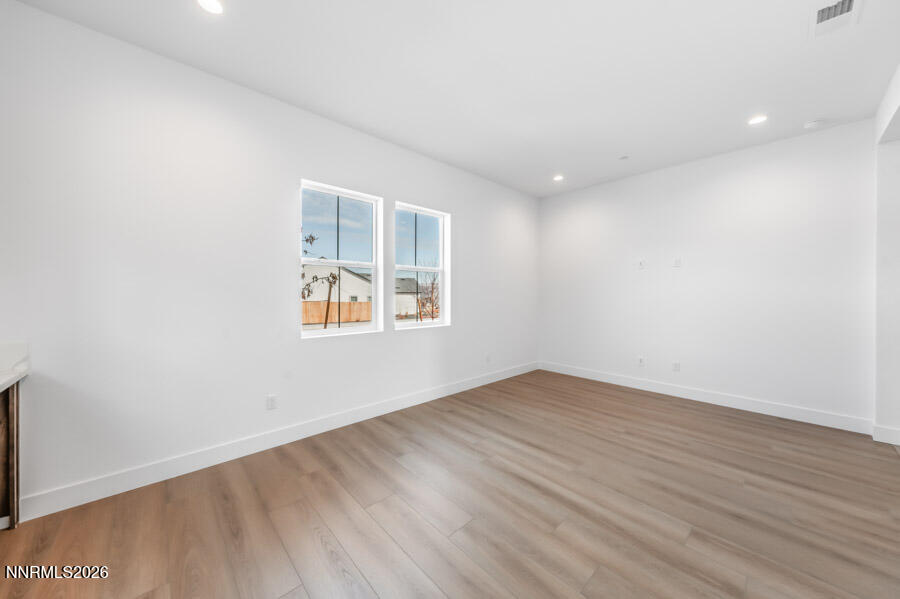 2400 Arrowroot Way, Unit CINNAMON 84 Sparks, NV 89441 - Photo 21 of 27 an empty room with wooden floor and windows