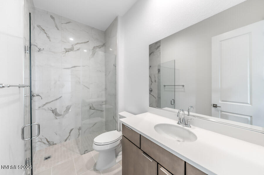 2400 Arrowroot Way, Unit CINNAMON 84 Sparks, NV 89441 - Photo 24 of 27 a bathroom with a sink toilet and shower