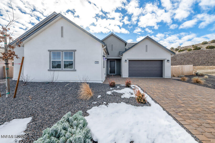 2400 Arrowroot Way, Unit CINNAMON 84 Sparks, NV 89441 - Photo 3 of 27 a view of a house with a yard covered in snow
