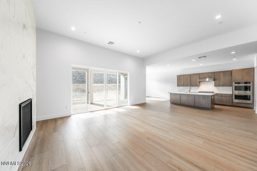 2400 Arrowroot Way, Unit CINNAMON 84 Sparks, NV 89441 - Photo 7 of 27 a living room with furniture and a wooden floor