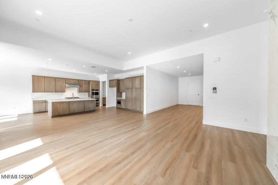 2400 Arrowroot Way, Unit CINNAMON 84 Sparks, NV 89441 - Photo 8 of 27 a view of a room with wooden floor