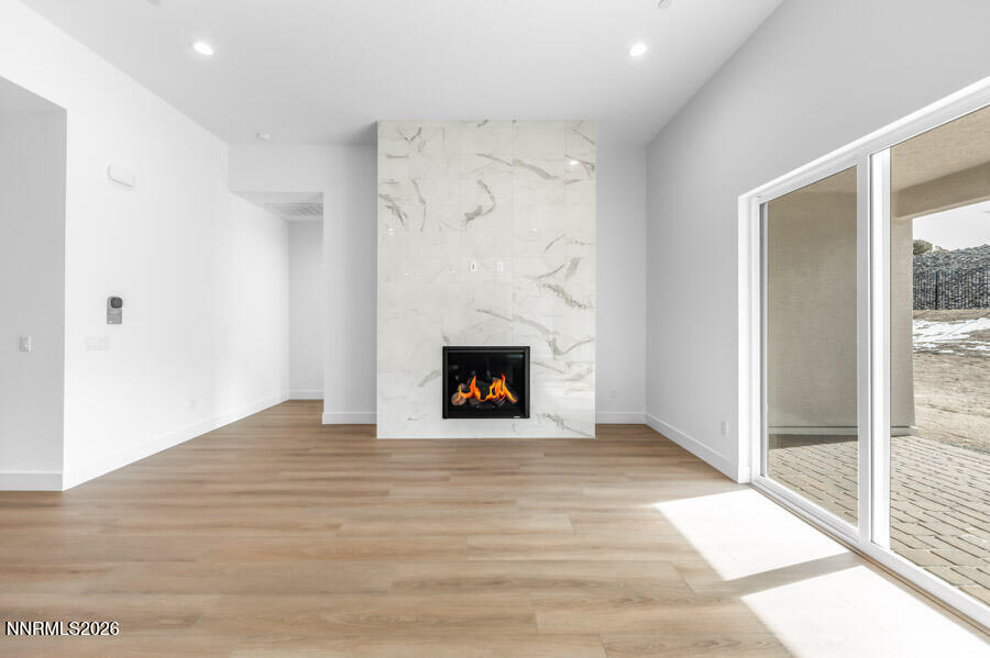 2400 Arrowroot Way, Unit CINNAMON 84 Sparks, NV 89441 - Photo 10 of 27 a view of an empty room with a window and a fireplace
