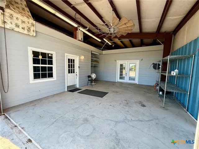 a view of an empty room with a garage