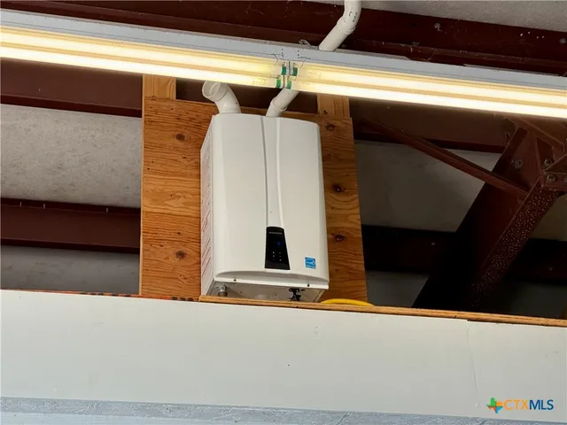 a view of a kitchen with a sink and a stove