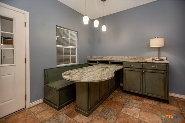 a bedroom with a bed and a mirror