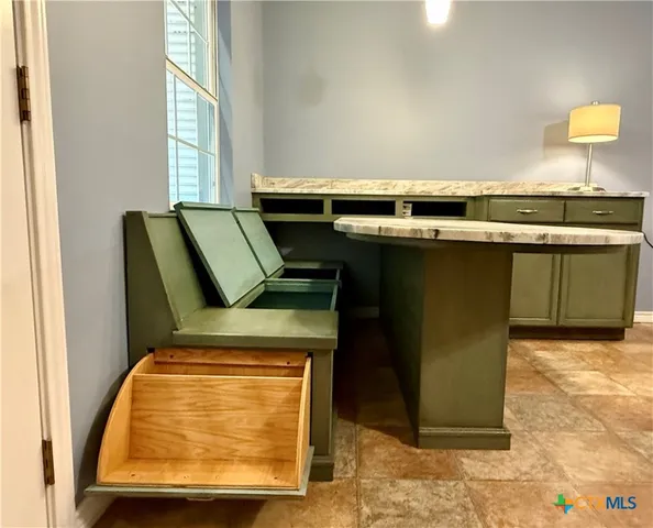 a kitchen with stainless steel appliances granite countertop a sink stove and microwave