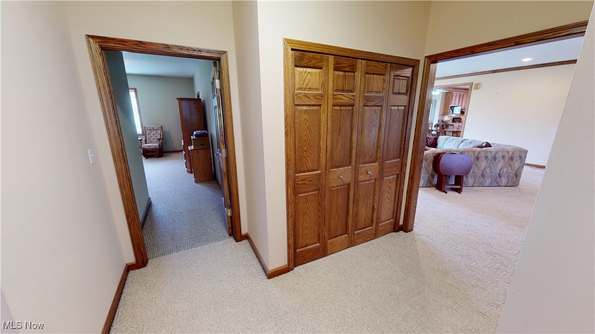 10323 Smith Road Litchfield, OH 44253 - Photo 30 of 50 Hall featuring light carpet, baseboards, and recessed lighting