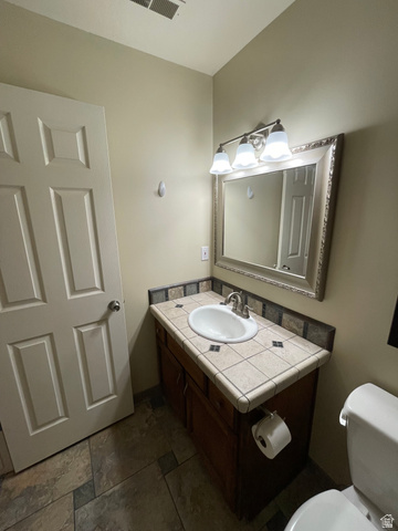 101 1501 Monroe, Unit 101 Ogden, UT 84404 - Photo 17 of 24 Bathroom featuring vanity and toilet