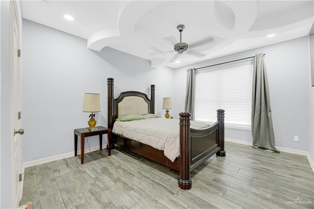 5305 North Crown Point Pharr, TX 78577 - Photo 11 of 24 a bedroom with a bed and a large window