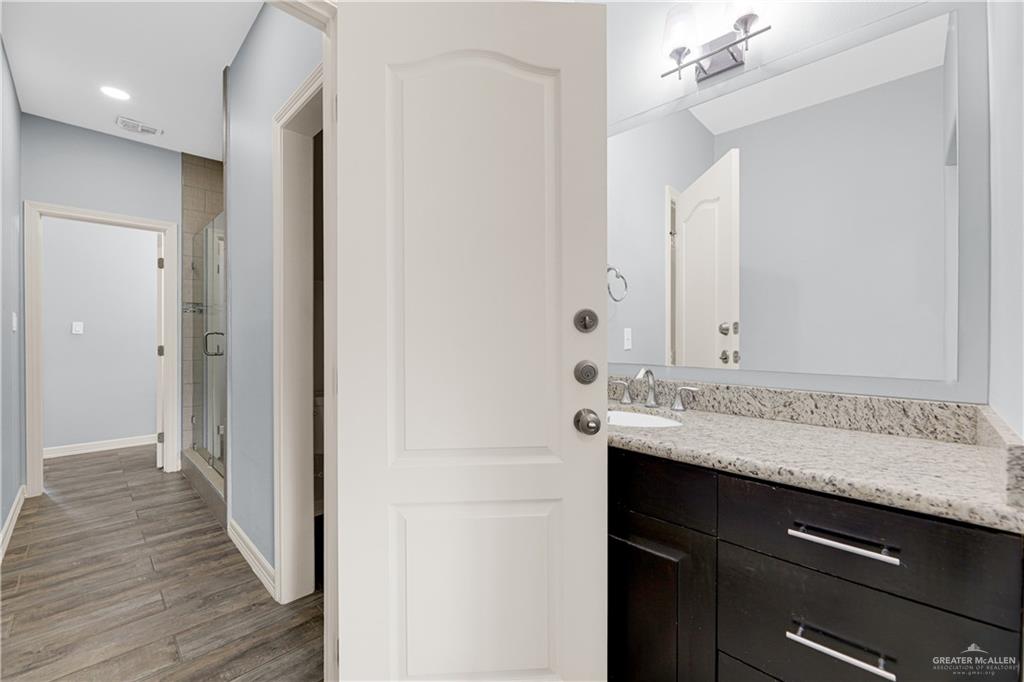 5305 North Crown Point Pharr, TX 78577 - Photo 16 of 24 a bathroom with a sink and a mirror
