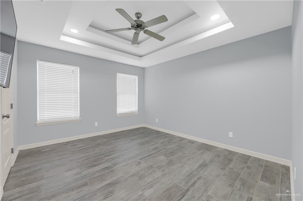 5305 North Crown Point Pharr, TX 78577 - Photo 17 of 24 wooden floor in an empty room with a window