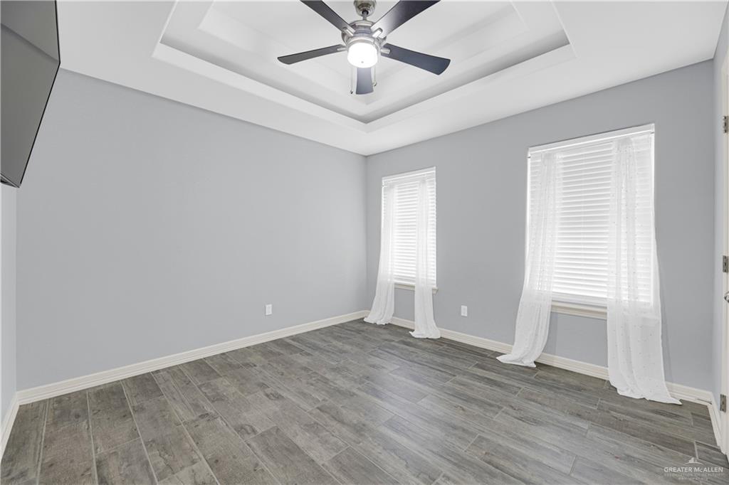 5305 North Crown Point Pharr, TX 78577 - Photo 22 of 24 wooden floor in an empty room with a window