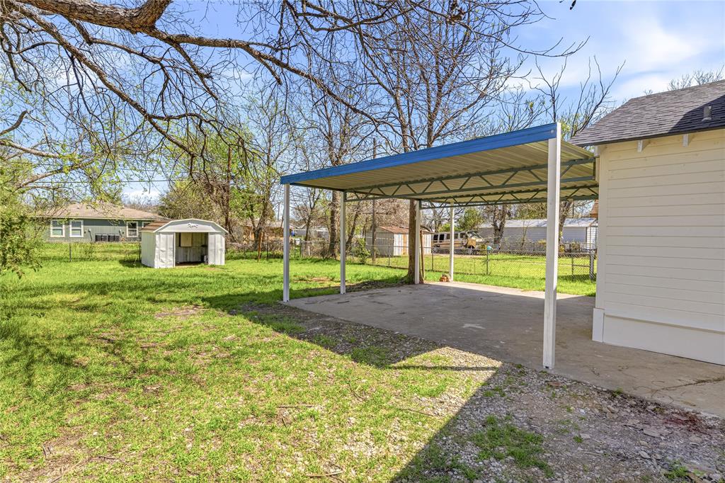 815 Garrison Street Waco, TX 76704 - Photo 27 of 36 a view of a house with backyard and a tree