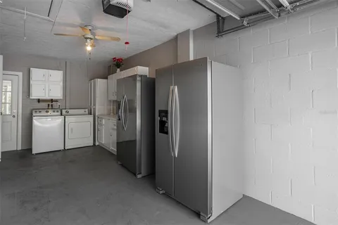 a kitchen with cabinets and stainless steel appliances